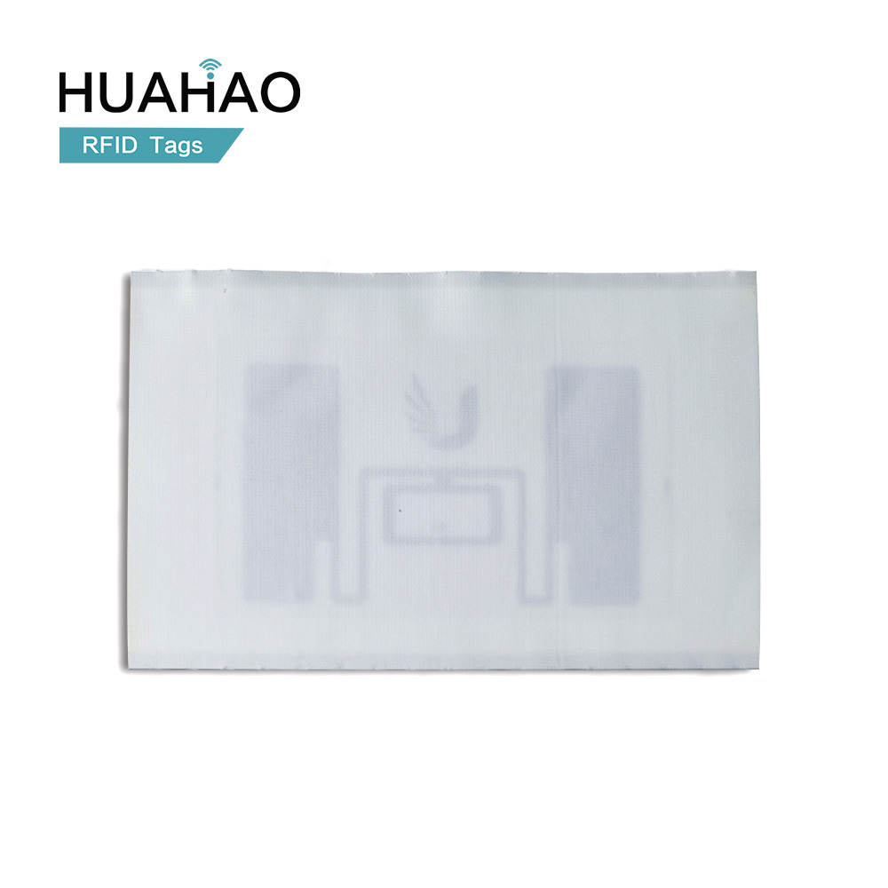 UHF RFID Label for Huahao Custom Factory Manufacture Rewritable Long Reading Range 860-960MHz Washing Care For Apparel Management